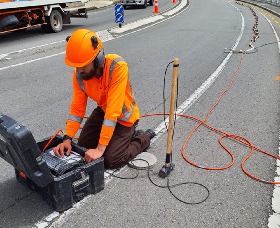 Worker using underground radar to test area for future construction