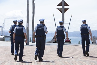 Police on patrol on the Wellington waterfront on a summer day.