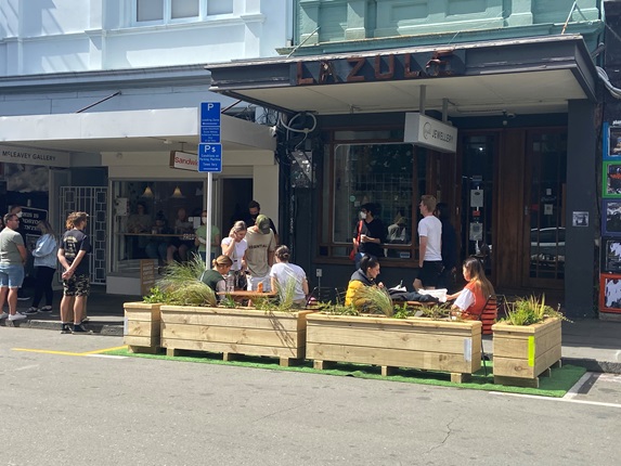 Trial parklet being used by public on Cuba Street