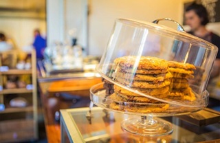 Cookies inside a glass cabinet.