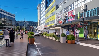 Artist render of Dixon Street with new planters on the street.