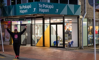 Te Pokapū Hapori exterior with Pastor Joe Serevi outside