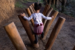 Girl playing on the Matairangi Nature Trail.