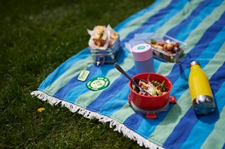 Reusables on a picnic blanket.