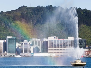 Carter Fountain with water spraying upwards in the harbour.