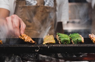 Yakitori sticks being cooked over a grill for Wellington On a Plate event.