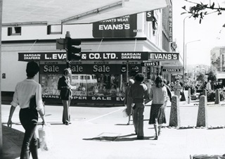Photo from 1975 of people walking down Cuba Street.