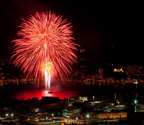 Bright red fireworks display in Wellington Harbour.