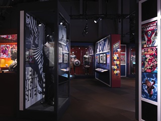 Marvel exhibition with posters, costumes and displays.
