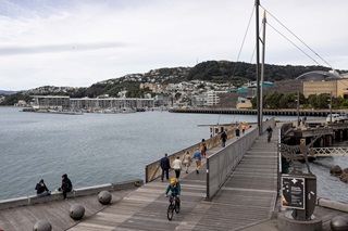 People walking and cycling along the Wellington waterfront.