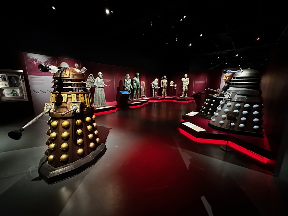 Daleks in foreground of Doctor Who exhibition