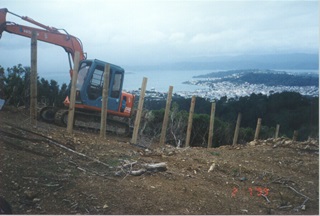 Digger working to build the Zealandia fence.
