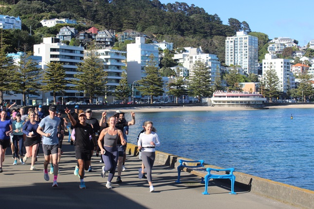 Group of people running on the Wellington waterfront.