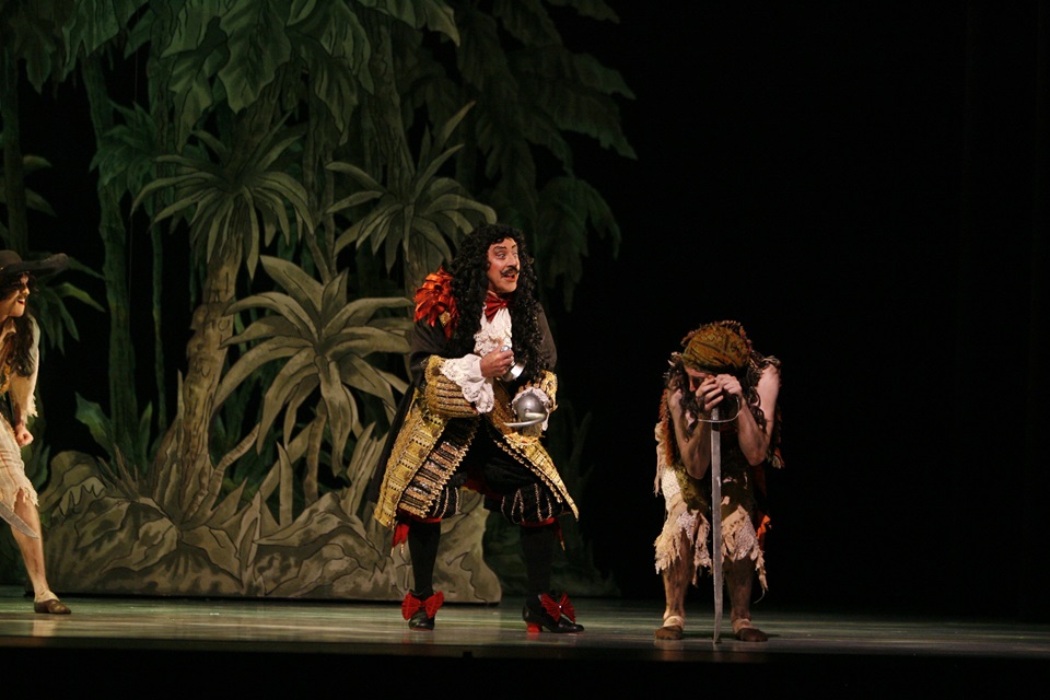 Sir Jon Trimmer performing as Hook on stage 