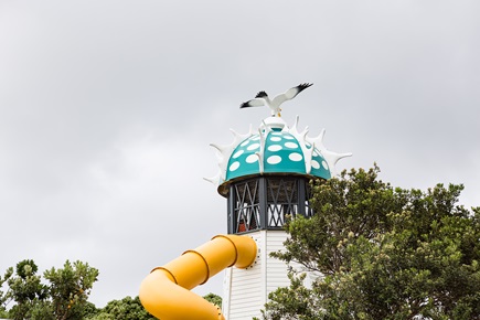 Refurbished cupola dome with seagull on top placed on iconic slide in Frank Kitts Playground site.