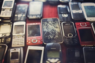 Picture of broken phones which are a form of ewaste