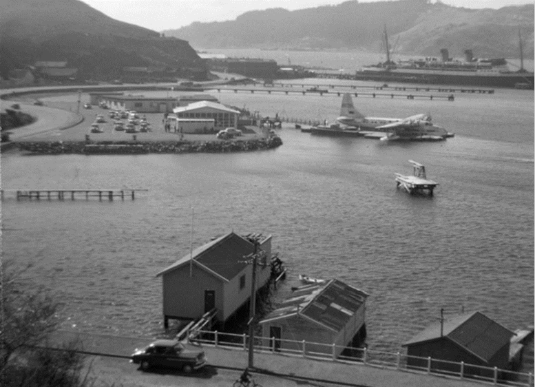 Circa 1950’s with a flying boat in the foreground and patent slip jetties in the background.